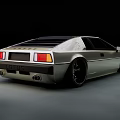 Silver Vintage Sports Car With Round Headlights And Custom Wheels On Night Street