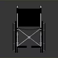 Black Modern Wheelchair With Metal Frame Armrests And Wheels On Reflective Surface