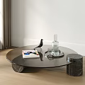 Round Glass Coffee Table with Marble Legs Featuring Magazine Bird Ornament Glass Bottle and Cups
