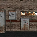 Rusted Industrial Equipment With Warning Signs And Control Panel On Brick Wall Background