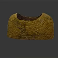 Traditional Golden Armor Accessory With Intricate Engraved Patterns And Historical Design