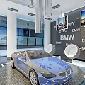 BMW Showroom Display With Blue Convertible Car And Brand Logos