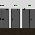 Gray Metal Double Doors With Single Door And Signs Above In Indoor Setting