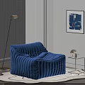 Blue Ribbed Velvet Bean Bag Chair In Cozy Living Room With Floor Lamp Side Table