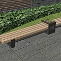 Wooden Outdoor Landscape Bench With Green Plants Brick Wall And Trash Bin On Stone Pavement