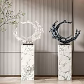 Modern Circular Sculpture Carving With Two White And Black Artworks On Marble Pedestals