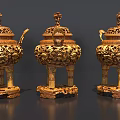 Exquisite Golden Sculptures with Intricate Carved Patterns Three Legged Design and Ornate Lids