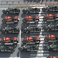 Multiple Motorcycles Neatly Arranged In Rows At Parking Lot Space