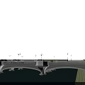 Modern Urban Bridge With Cars Street Lamps Water Green Grass And White Buildings