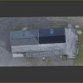 Wooden House With Blue Roof White Walls Wooden Deck Near Small Shed On Grass