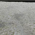 Weathered Rocky Terrain Covered With Green Moss And Small Puddle In Center