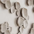 Modern White Textured Wall With 3D Sculptural Decorative Circular Elements