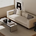 Modern Two Seater Sofa With Patterned Cushions Coffee Table Decorative Items And Minimalist Wall Art