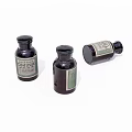 Three Dark Glass Bottles With EXMINA Label And Closed Caps On White Background