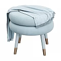 Light Blue Stool With Layered Seat Cushions Legs Gold Accents Draped Blanket