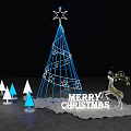 Blue Lit Christmas Tree With Star Top Reindeer Ornament Small Trees And Merry Christmas Sign