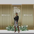 2024 STAR METEOG Red Carpet Photo Op Spot with Golden Backdrop Green Plants White Flowers