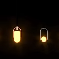 Modern Pendant Lights With Different Designs Illuminated In Yellow Glow On Black Background