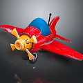 Red Toy Airplane With Blue Cockpit Yellow Propeller Black Tail And Wheels