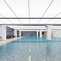 Modern Indoor Swimming Pool With Lounge Chairs And Bright Lighting