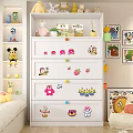 White Chest of Drawers with Colorful Cartoon Stickers and Knobs in Kids Room
