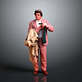 Man In Pink Suit Holding Beige Coat And Green Tie Against Gray Background