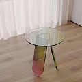 Modern Round Glass Top Side Table With Colorful Legs On Wooden Floor