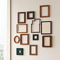 Various Colored Wooden Photo Frames Arranged On Wall With Different Shapes