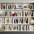 Organized White Bookshelf With Book Collection Decorative Items Green Apples And Red Vase