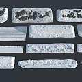 Natural Snow Covered Stones with Various Textures and Shapes in Winter Landscape