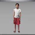 Little Girl Standing in White Top and Red Plaid Skirt on Gray Background with Sandals