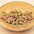 Yellow Bowl With Green Rim Filled With Cashews And Almonds As Healthy Nut Mix