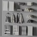 Gray And White Towels Featuring Hanging And Rolled Styles Arranged On Wall