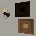 Black And Brown Wall Frames With Decorative Design And Wall Lamp