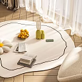 White Round Styled Rug With Black Border Flower Fruit Bowl And Books On Wooden Floor