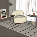Cozy Living Room Corner With Beige Curved Armchair Small Coffee Table And Green Plant