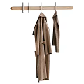 Cozy Brown Winter Clothing With Long Coat And Knitted Sweater Hanging On Hooks