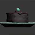 Delicious Chocolate Cake on Blue Plate with Top Blue Decorative Ball and Sliced Exposed Layers
