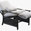 Comfortable White Cushioned Lounge Chair With Black Wicker Frame And Ottoman