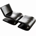Stylish Black Leather Lounge Chair With Modern Curved Design And Comfortable Ottoman