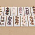Assorted Sweet Desserts Displayed on White Plates Over Wooden Table Surface 3d model