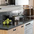 Modern Kitchen With Wooden Cabinets Black Countertop And Stainless Steel Oven Green Apples Hanging Utensils