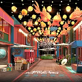 Vibrant Commercial Street With Colorful Buildings Hanging Goldfish Lanterns Street Stalls Illuminated Lights And Greenery