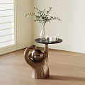 Modern Side Table with Copper Sculptural Base Vase Greenery and White Cup