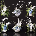 White And Blue Floral Arrangements In Decorative Vases With Green Leaves