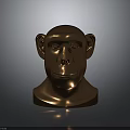 Bronze Colored Monkey Head Sculpture on Dark Background With Reflective Surface
