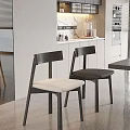 Modern Black Dining Chairs With White Cushions In Kitchen Dining Area