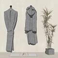Two White Bathrobes Hanging On Wall In Modern Interior With Green Plant