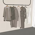 Clothes with Various Styles Hanging on Metal Rack Neutral Beige Brown White Wall Light Floor