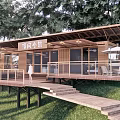 Wooden Guesthouse Building With Terrace Lawn And Surrounded By Trees